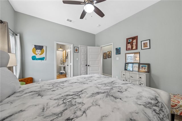 bedroom featuring ceiling fan and ensuite bathroom