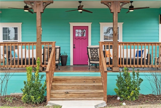 wooden terrace with ceiling fan and covered porch