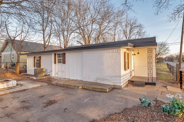 exterior space featuring a patio and cooling unit