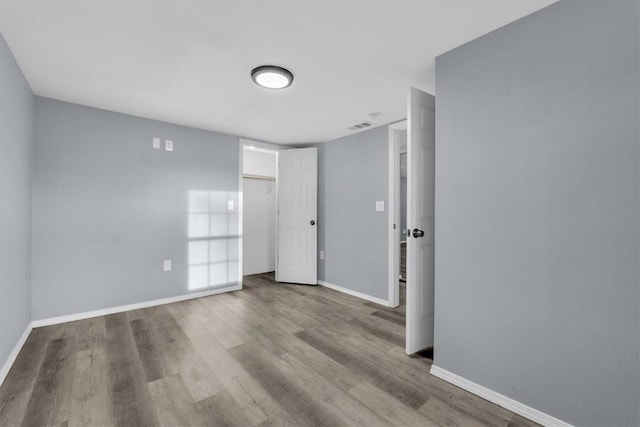 empty room with light wood-type flooring