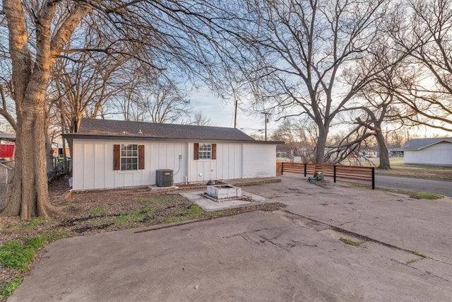 ranch-style home with central AC and a patio area