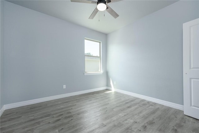 unfurnished room featuring ceiling fan and wood-type flooring