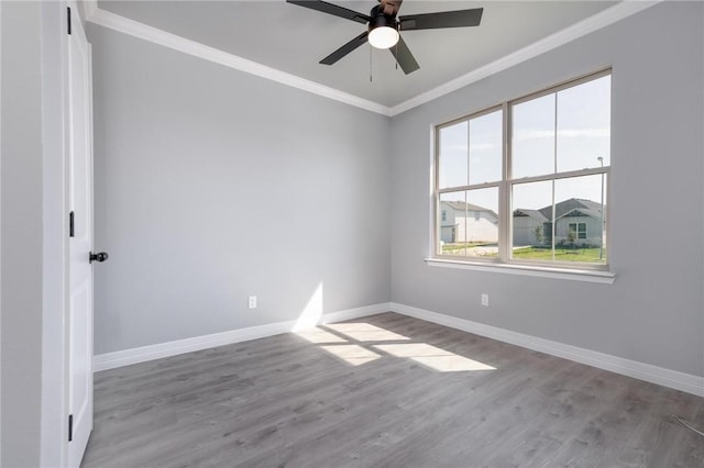 spare room with light hardwood / wood-style flooring, ceiling fan, and ornamental molding