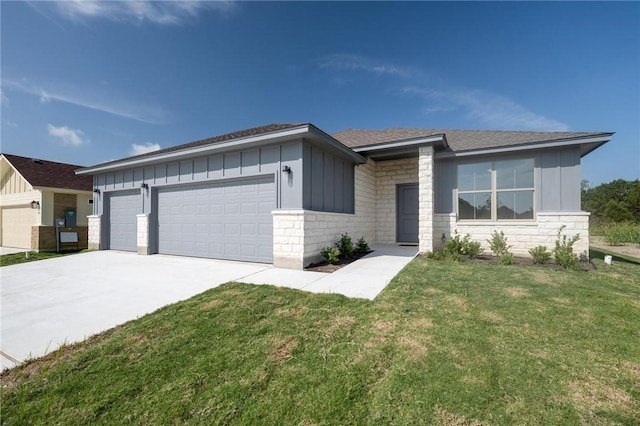 view of front of home with a garage and a front yard