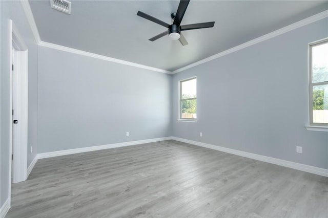 unfurnished room featuring light hardwood / wood-style flooring, ceiling fan, and crown molding