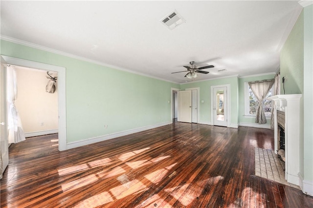 unfurnished living room featuring a tile fireplace, crown molding, ceiling fan, and dark hardwood / wood-style flooring