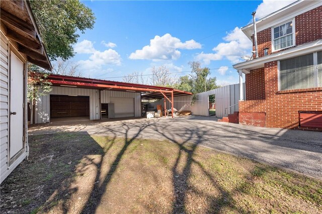 view of yard with an outbuilding and a garage