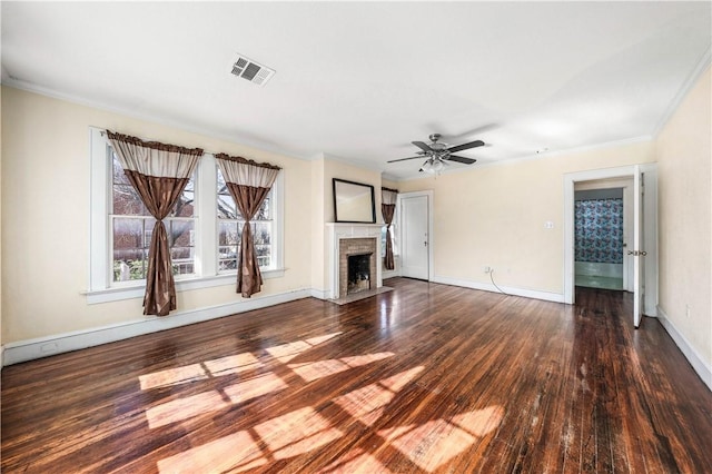 unfurnished living room featuring dark wood-type flooring, ceiling fan, and ornamental molding