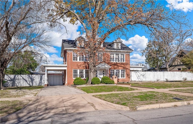 view of front of house with a carport and a front lawn