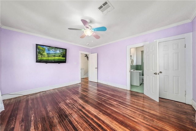 unfurnished bedroom featuring ceiling fan, ornamental molding, dark wood-type flooring, and ensuite bath