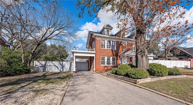 view of front of house featuring a front lawn and a carport