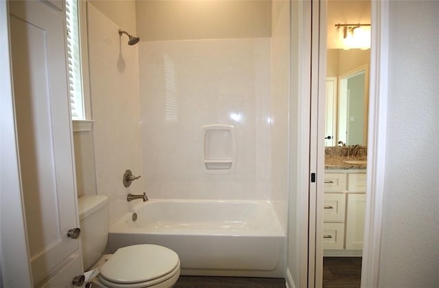 full bathroom with vanity, bathing tub / shower combination, toilet, and hardwood / wood-style flooring