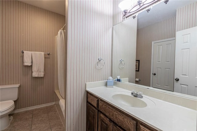 full bathroom featuring vanity, a notable chandelier, toilet, tile patterned floors, and shower / bath combo with shower curtain