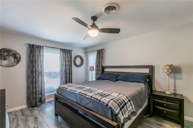 bedroom featuring ceiling fan and wood-type flooring