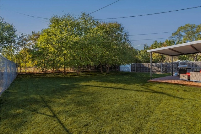 view of yard with a wooden deck