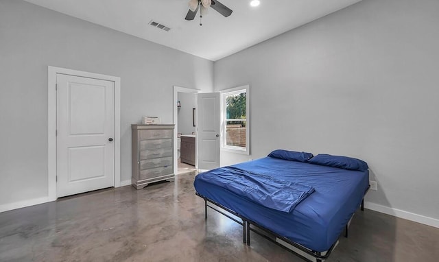 bedroom with ceiling fan, ensuite bathroom, and vaulted ceiling