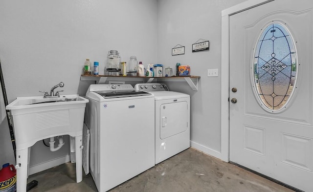 washroom featuring washer and dryer and sink