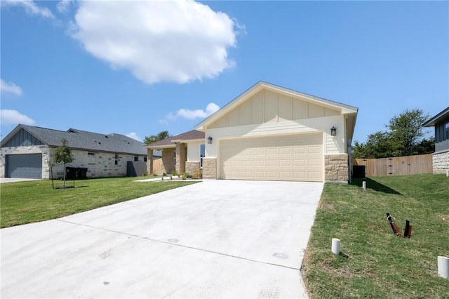 view of front of home with a front lawn and a garage