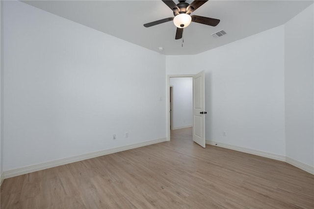 unfurnished room featuring ceiling fan and light wood-type flooring