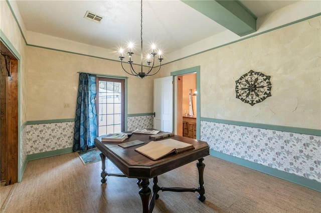 office area with visible vents, wallpapered walls, beamed ceiling, wainscoting, and an inviting chandelier