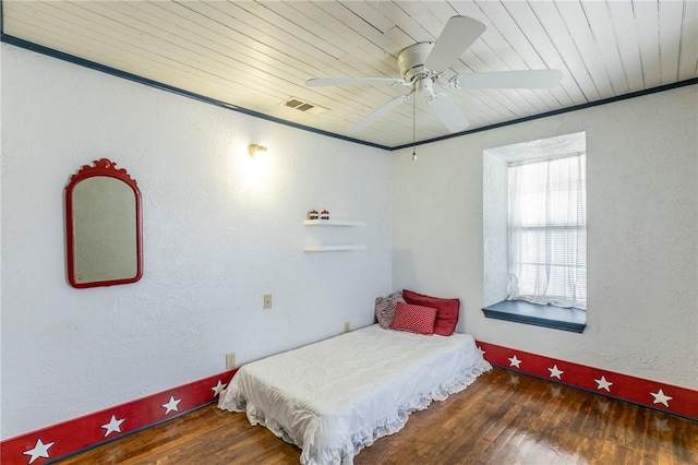 bedroom featuring wood ceiling, wood finished floors, and visible vents