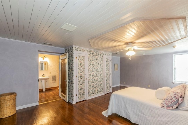 bedroom with a ceiling fan, wooden ceiling, wood finished floors, and baseboards