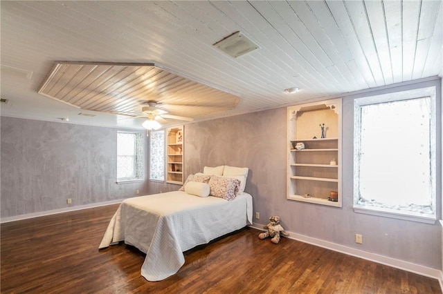 bedroom featuring visible vents, wooden ceiling, and wood finished floors