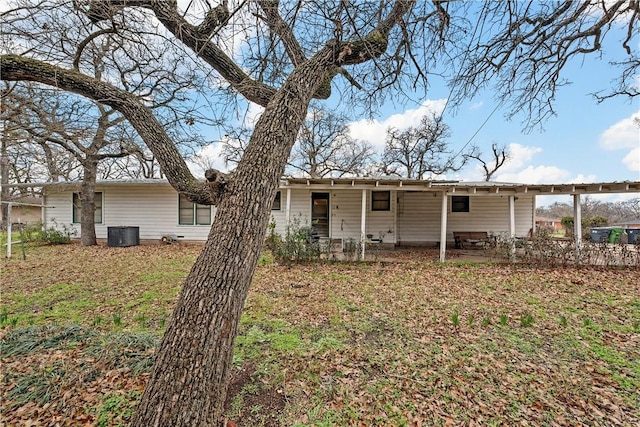 back of property featuring central AC