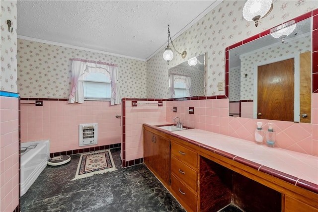 bathroom featuring vanity, ornamental molding, a textured ceiling, tile walls, and heating unit