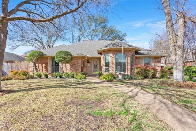 ranch-style house with a front lawn