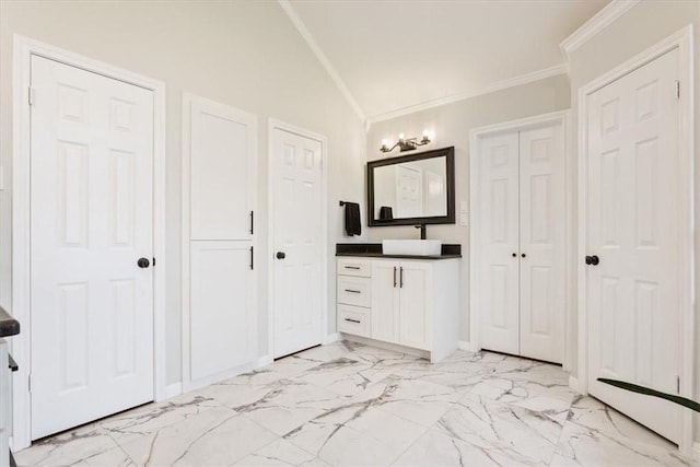 bathroom with marble finish floor, ornamental molding, a closet, and vanity