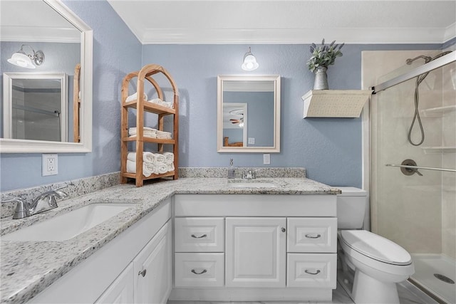 bathroom featuring toilet, ornamental molding, a shower with shower door, and vanity