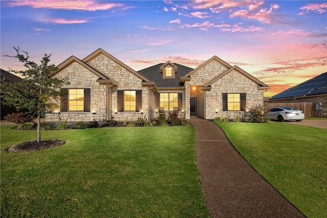 craftsman-style house featuring a yard