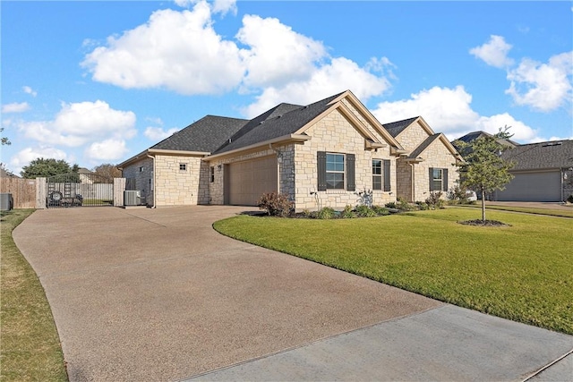 view of front facade featuring central AC, a garage, and a front lawn