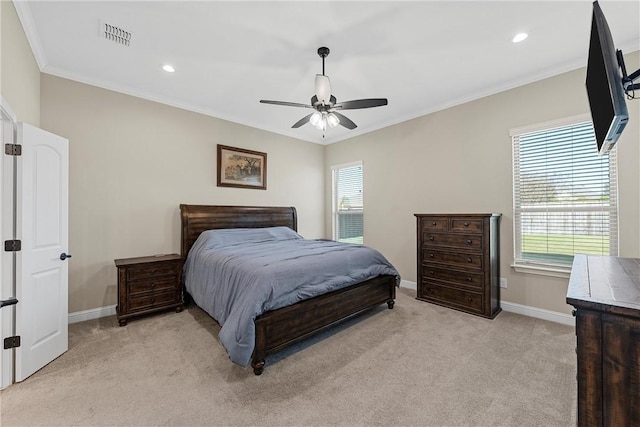 bedroom featuring ceiling fan, crown molding, and light carpet