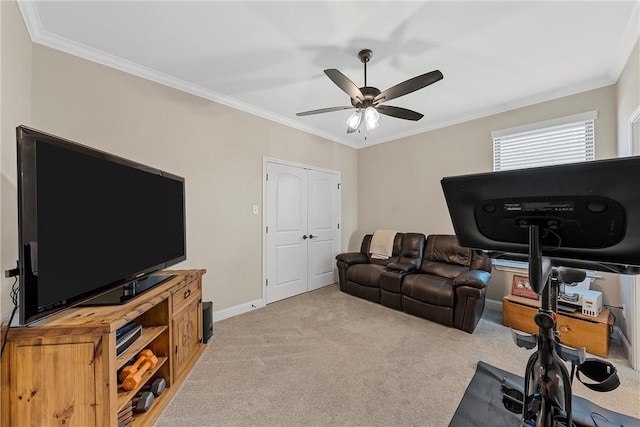 exercise room featuring light carpet, ceiling fan, and ornamental molding