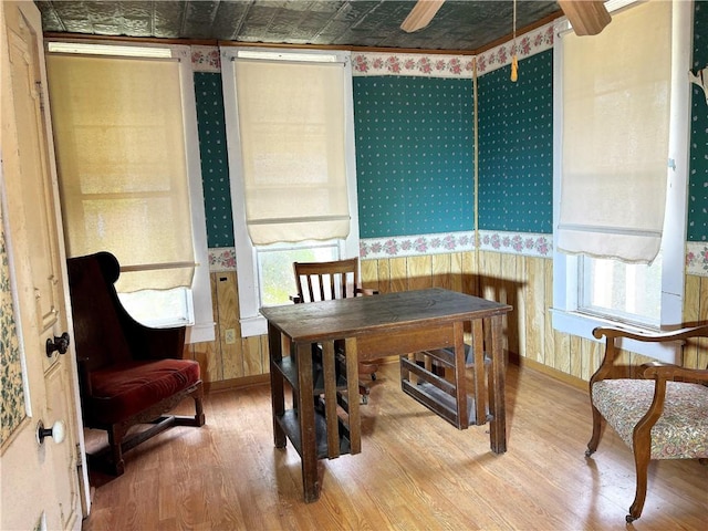 dining space with wood-type flooring