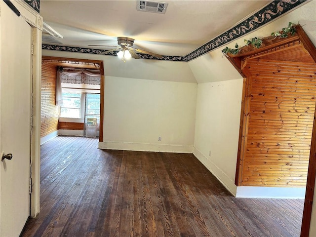 additional living space with lofted ceiling, ceiling fan, and dark hardwood / wood-style floors