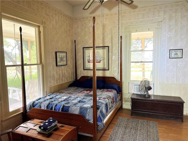 bedroom featuring hardwood / wood-style floors and ceiling fan