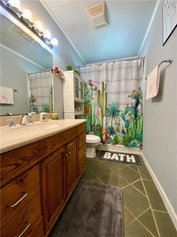 bathroom with tile patterned flooring, vanity, toilet, and crown molding