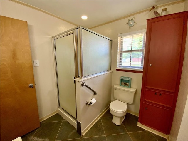 bathroom featuring tile patterned floors, toilet, an enclosed shower, and ornamental molding