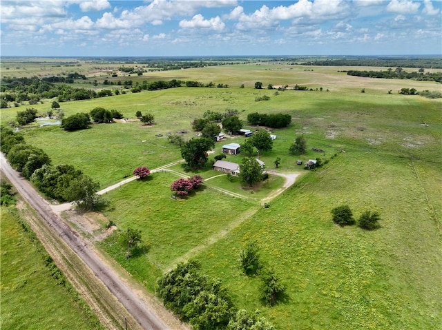 birds eye view of property with a rural view