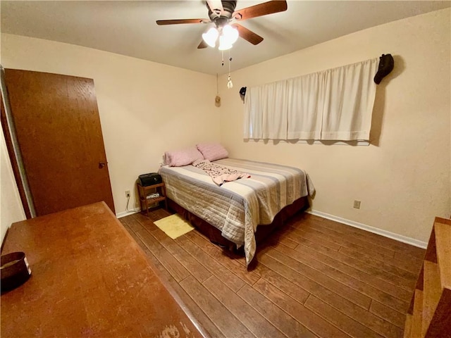 bedroom featuring ceiling fan and dark hardwood / wood-style floors