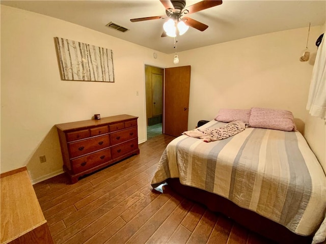 bedroom with hardwood / wood-style floors and ceiling fan