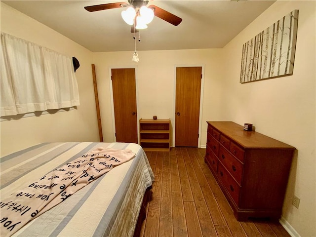 bedroom featuring dark hardwood / wood-style floors and ceiling fan