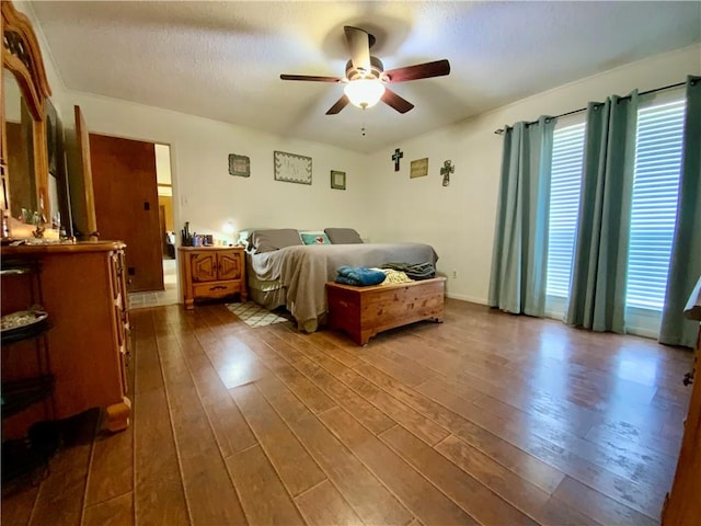 bedroom featuring dark hardwood / wood-style floors and ceiling fan