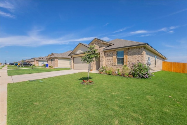 ranch-style house featuring a front yard and a garage