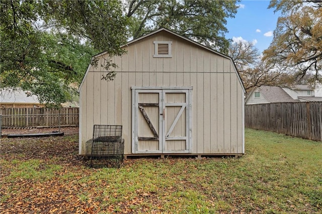 view of outbuilding featuring a lawn