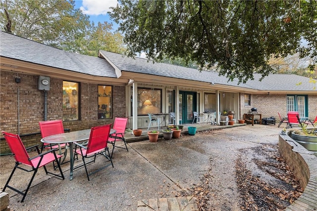 rear view of property featuring a patio area