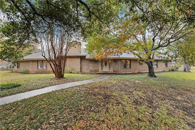 ranch-style house with a front yard